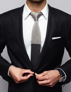 Black suit. You should have a nice suit in your closet. Suits can be very flattering as long as they fit right. The tie shown here is fashion forward and shows you have a modern sense of style. 